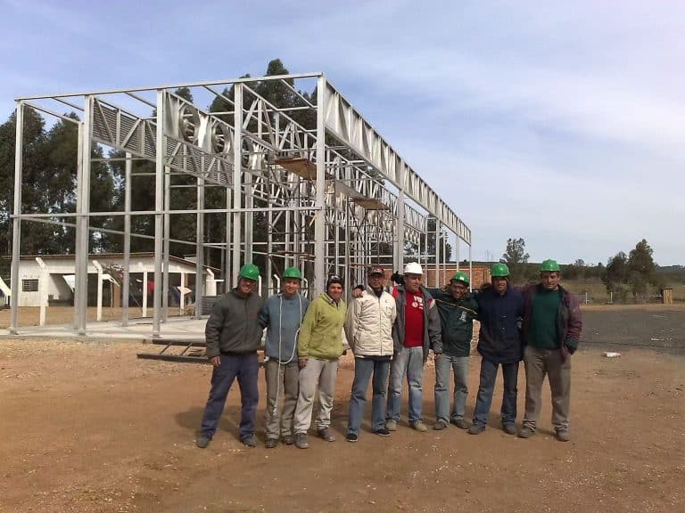 Brazilian customer in front of lumber drying kiln